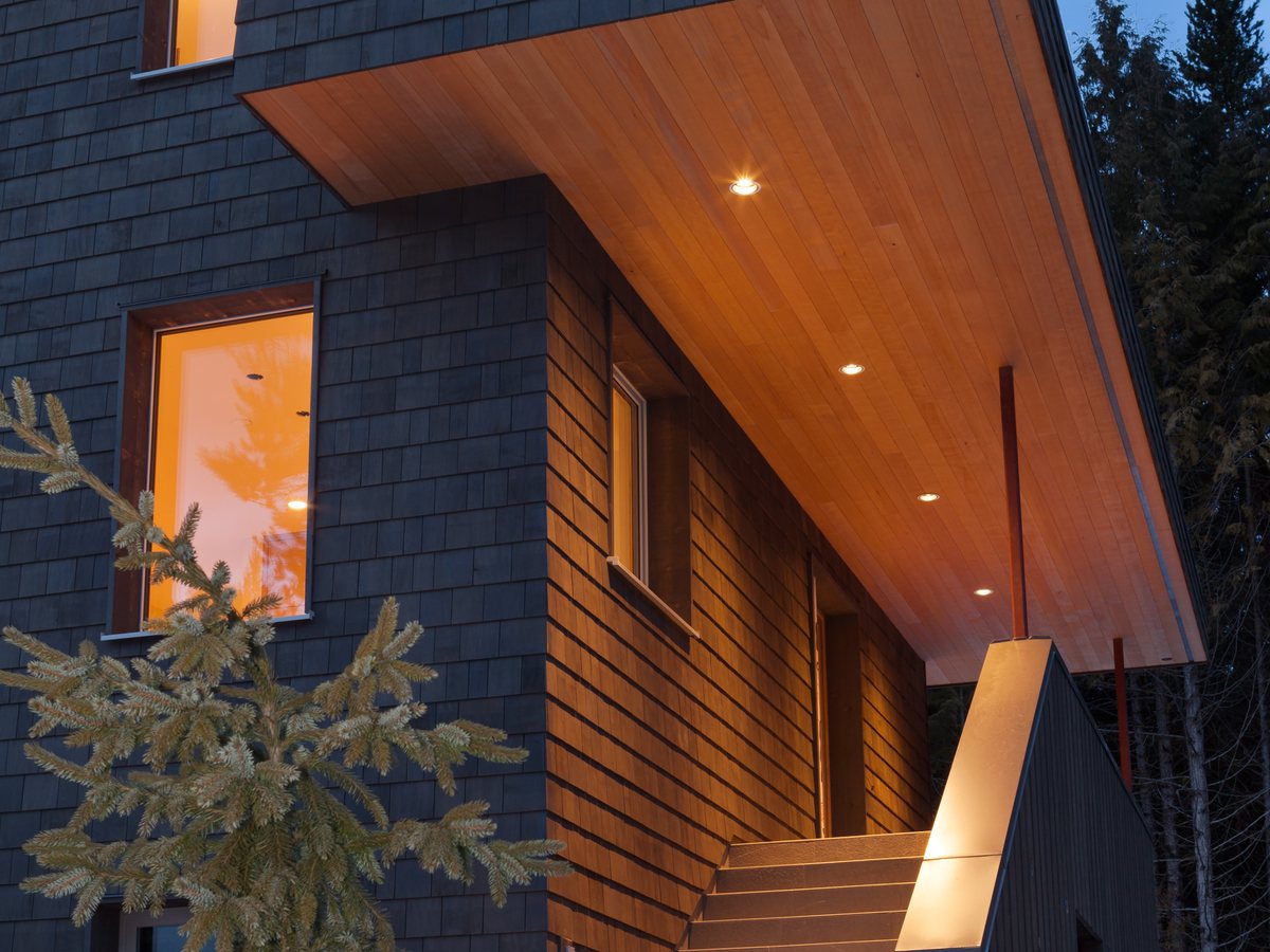 Covered entrance area with timber facade