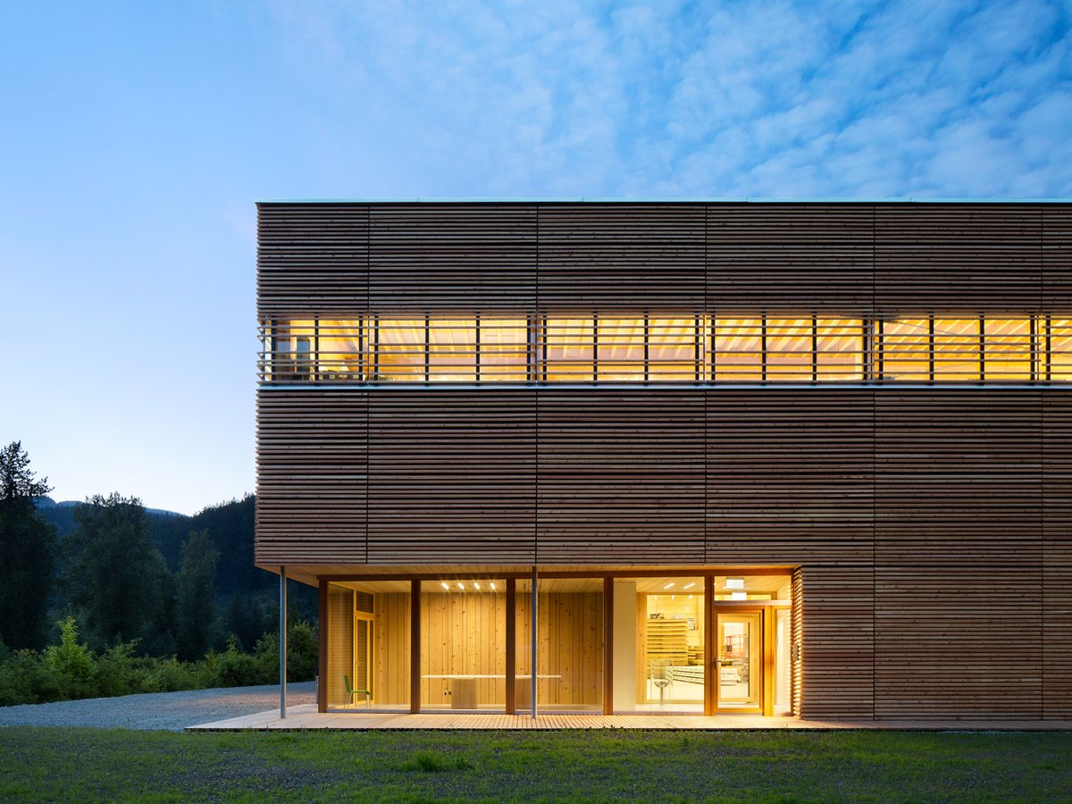 Timber building with a large glass facade at night
